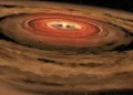 This artist's illustration shows a protoplanetary disk swirling around a young star. New research showing how a young star can send some material back into the disk helps explain an observational discrepancy. Image Credit: NASA/JPL-Caltech/T. Pyle (SSC)