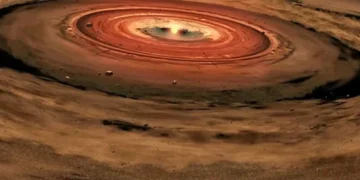 This artist's illustration shows a protoplanetary disk swirling around a young star. New research showing how a young star can send some material back into the disk helps explain an observational discrepancy. Image Credit: NASA/JPL-Caltech/T. Pyle (SSC)