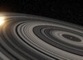 Artist’s conception of the extrasolar ring system circling the young giant planet or brown dwarf J1407b. The rings are shown eclipsing the young Sun-like star J1407, as they would have appeared in early 2007. Credit: Ron Miller