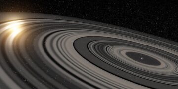 Artist’s conception of the extrasolar ring system circling the young giant planet or brown dwarf J1407b. The rings are shown eclipsing the young Sun-like star J1407, as they would have appeared in early 2007. Credit: Ron Miller