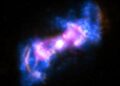 This composite view of the active galaxy Markarian 573 combines X-ray data (blue) from NASA's Chandra X-ray Observatory and radio observations (purple) from the Karl G. Jansky Very Large Array in New Mexico with a visible light image (gold) from the Hubble Space Telescope. Markarian 573 is an active galaxy that has two cones of emission streaming away from the supermassive black hole at its center. Credit: X-ray: NASA/CXC/SAO/A.Paggi et al; Optical: NASA/STScI; Radio: NSF/NRAO/VLA
